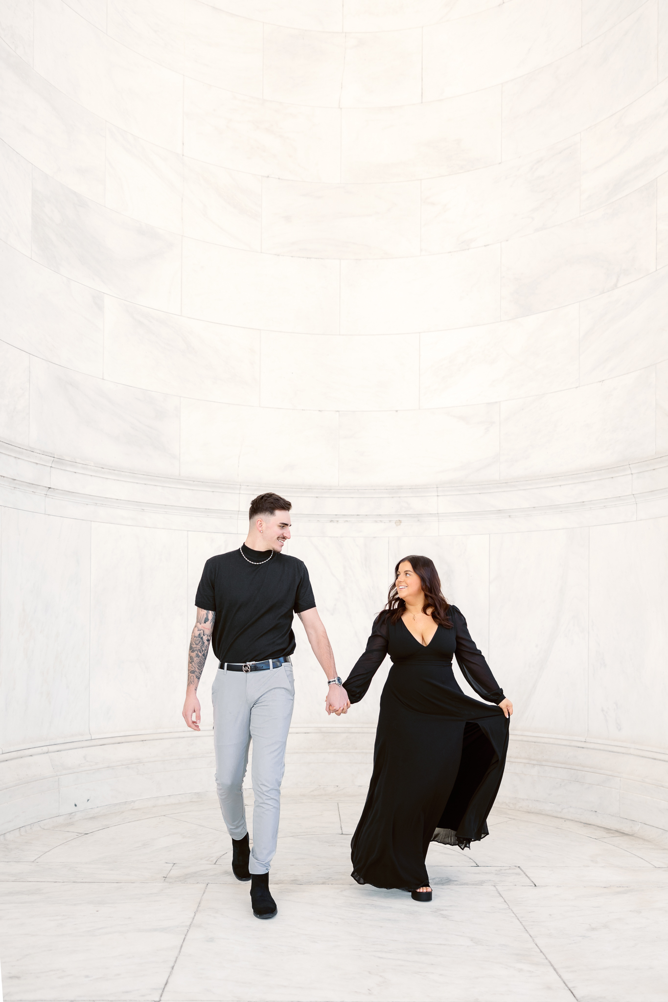 A couple walking at the Jefferson Memorial